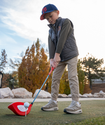Young golfer practising with the Little Links Big Swing kids golf driver