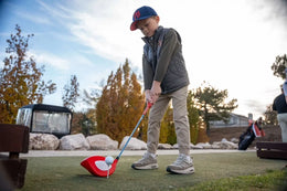 Junior golfer practising with the Little Links Big Swing driver